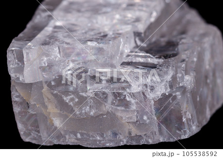 Macro mineral stone Iceland spar on black background Macro mineral stone Iceland spar on black background 105538592