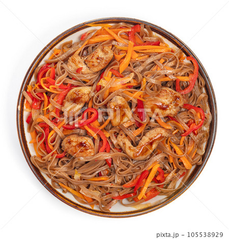 Asian fried buckwheat noodles with chicken and vegetables isolated on white background. 105538929