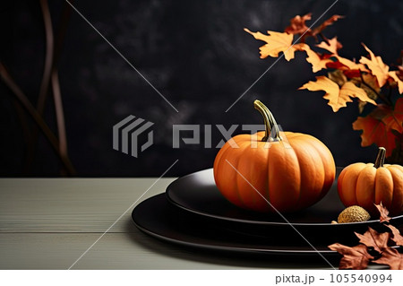 Thanksgiving day table setting with pumpkins, plate on black table. Generative AI. 105540994