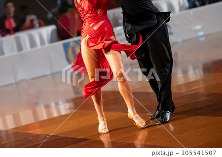 a couple dance a Latin dance. the legs of a dancing couple a couple dance a Latin dance. the legs of a dancing couple 105541507