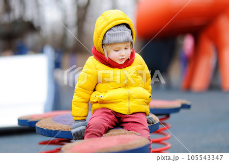 Cute little boy having fun on outdoor playground 105543347