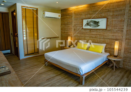 Bedroom inside a cabin on the beach in Haad Tien Beach in shark bay, koh Tao, Thailand Bedroom inside a cabin on the beach in Haad Tien Beach in shark bay, koh Tao, Thailand 105544239