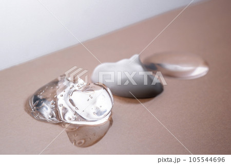 Cream, hyaluronic gel and serum on a beige background. 105544696