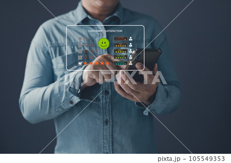 a client use smartphone select on the five star to give satisfaction in service.rating very impressed.Customer service and Satisfaction concept. 105549353