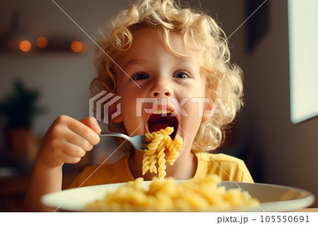 Cute little kid boy eating spaghetti bolognese or pasta macaroni bolognese at home. Happy child eating fresh cooked healthy meal with noodles. Generative Ai. 105550691