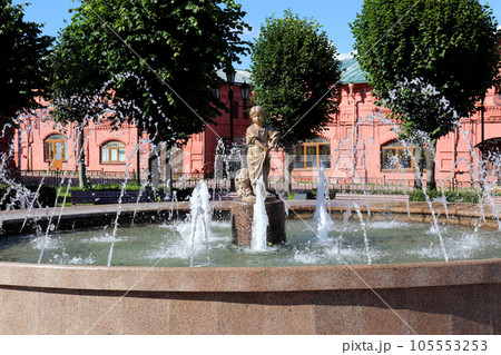 Fountain with a statue of Girl mushroom picker Fountain with a statue of Girl mushroom picker 105553253