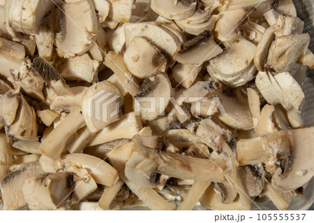 Background made of Frozen food sliced mushrooms champignon homemade. Harvesting concept. Stocking up vegetables for winter storage 105555537