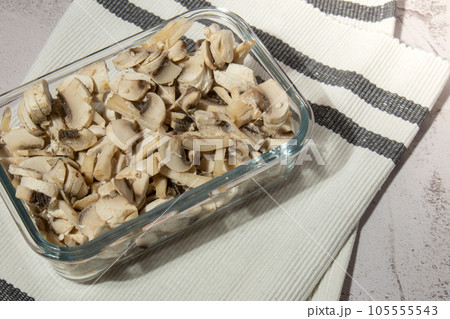 Frozen food sliced mushrooms champignon homemade. Harvesting concept. Stocking up vegetables for winter storage Frozen food sliced mushrooms champignon homemade. Harvesting concept. Stocking up vegetables for winter storage 105555543