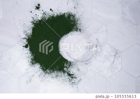 Blue-green algae Chlorella and spirulina powder on table round frame copy space. Super powder. Natural supplement of algae. Detox superfood drink cocktail. Food supplement source of protein and beta Blue-green algae Chlorella and spirulina powder on table round frame copy space. Super powder. Natural supplement of algae. Detox superfood drink cocktail. Food supplement source of protein and beta 105555613