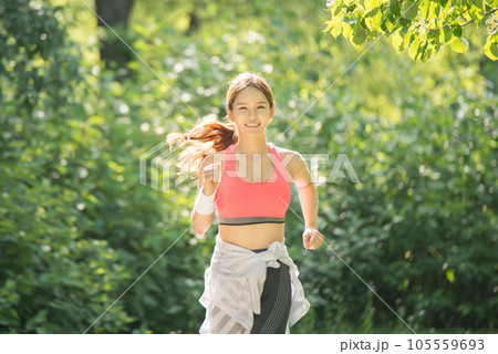 beautiful woman running in the park beautiful woman running in the park 105559693