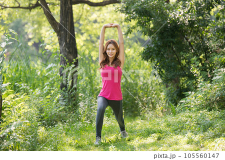 young woman doing yoga in the park young woman doing yoga in the park 105560147