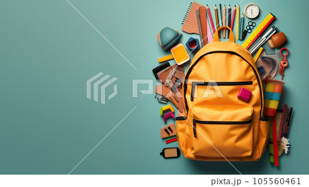 Yellow backpack on blue background with school supplies. Top view. Education or Back to school concept. Yellow backpack on blue background with school supplies. Top view. Education or Back to school concept. 105560461