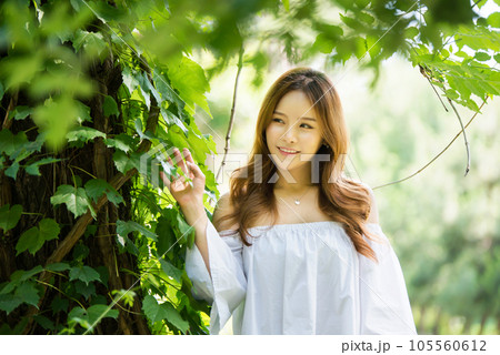 a beautiful woman in the forest a beautiful woman in the forest 105560612