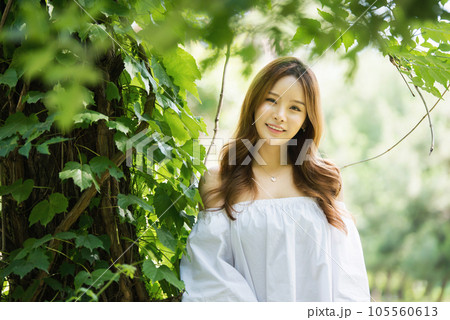 a beautiful woman in the forest 105560613