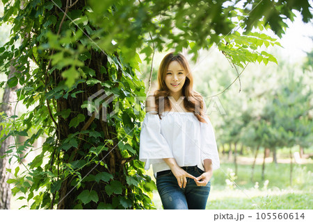 a beautiful woman in the forest 105560614