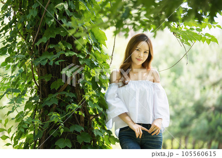a beautiful woman in the forest 105560615