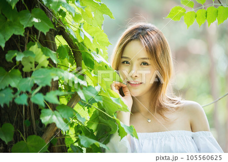 a beautiful woman in the forest a beautiful woman in the forest 105560625