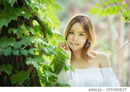 a beautiful woman in the forest 105560627
