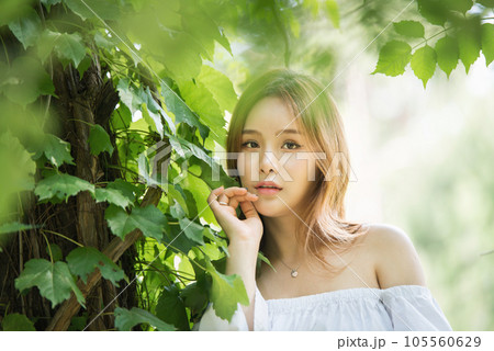 a beautiful woman in the forest 105560629