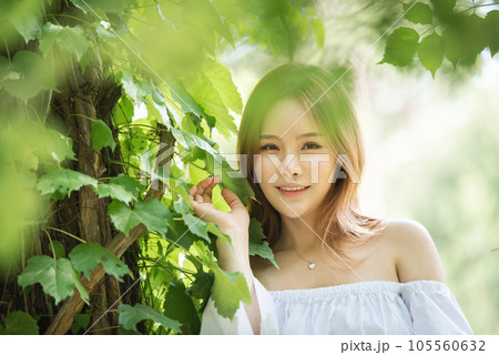 a beautiful woman in the forest 105560632