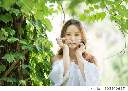 a beautiful woman in the forest 105560637
