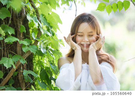 a beautiful woman in the forest 105560640