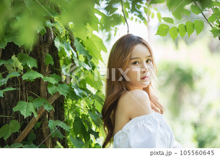 a beautiful woman in the forest 105560645