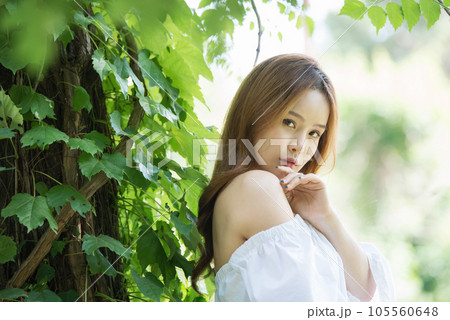 a beautiful woman in the forest 105560648