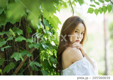 a beautiful woman in the forest 105560650