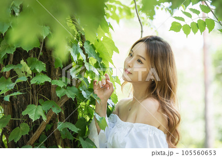a beautiful woman in the forest 105560653