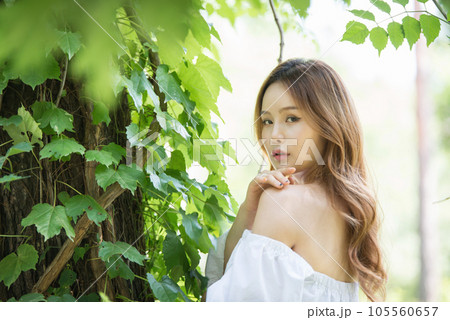 a beautiful woman in the forest 105560657