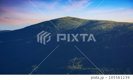 nature scenery with mountains and valleys. landscape background with forested rolling hills in summer nature scenery with mountains and valleys. landscape background with forested rolling hills in summer 105561239