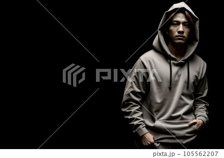 グレーのパーカーを着て暗闇に立つ不良少年 AI generated グレーのパーカーを着て暗闇に立つ不良少年 AI generated 105562207