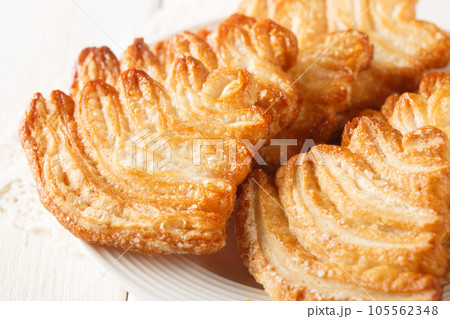 Fresh baked palmier puff pastry closeup on the plate. Horizontal 105562348