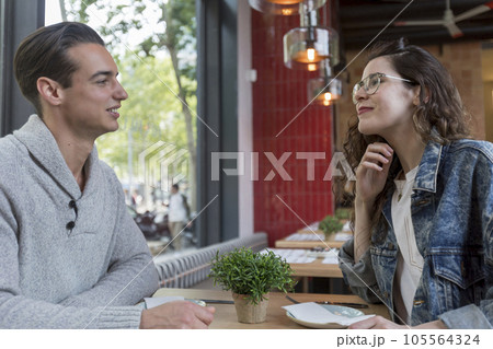Couple Meeting In Busy Cafe Restaurant 105564324