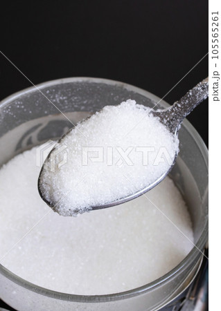 Sugar in a spoon by the can Sugar in a spoon by the can 105565261