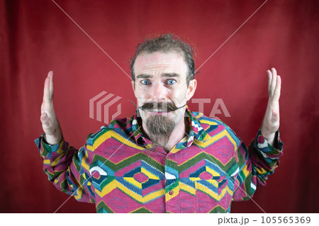 Hipster terrified man with mustache and hands blocking sides with fear face 105565369