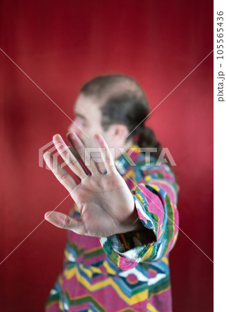 Hipster man moving head and saying No or Stop to camera with open hand Hipster man moving head and saying No or Stop to camera with open hand 105565436