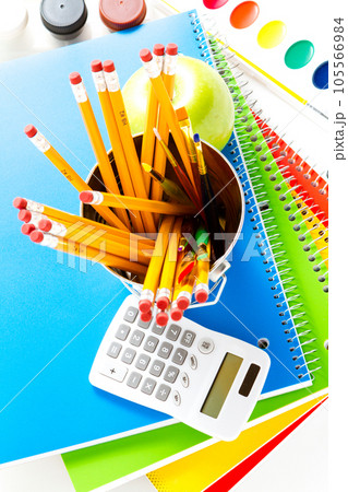 Variety of school supplies on a white background. 105566984