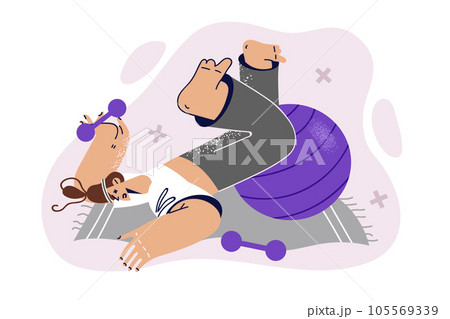 Athletic woman lies on fitness mat with dumbbells and pilates ball and suffers from injury in gym 105569339