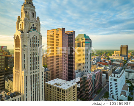 Golden lighting striking Huntington and LeVeque Towers at sunrise in Columbus Ohio aerial of city 105569987