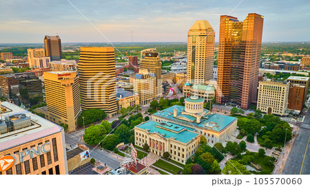 Capital Square Foundation at sunrise with sun on skyscrapers aerial 105570060