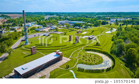 Aerial of Ariel Foundation Park during summer with decaying buildings and tree path park 105570148