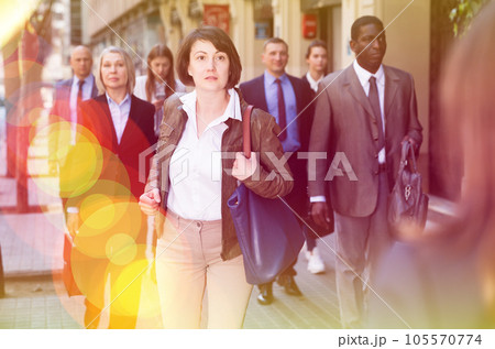 Hurrying woman walking on street 105570774