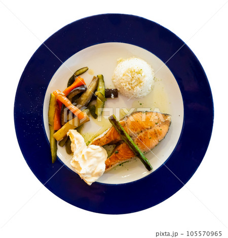 Nice serving of seared salmon with rice and vegetables on side 105570965