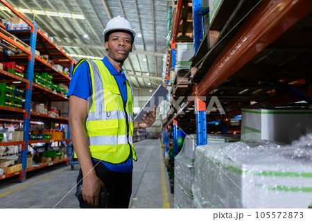 Portrait man american african looking at camera, Male factory company employee scanning box checking 105572873