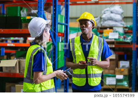 Group worker warehouse working brainstorm checklist product to shelf in warehouse store. 105574599