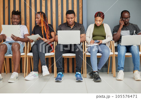 A group of candidates are being interviewed on a laptop A group of candidates are being interviewed on a laptop 105576471