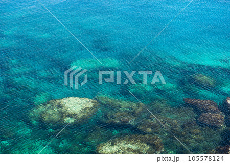 Emerald, blue sea water background. Water ripples 105578124
