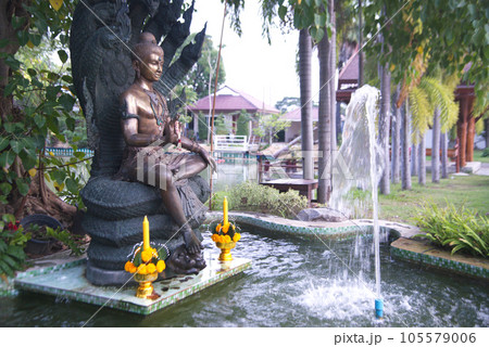 Statues of angels or guardians protecting and decorating located in a pond and fountain inside Wat Pa Pathom Chai. Located at Nakhon Pathom Province in Thailand. Statues of angels or guardians protecting and decorating located in a pond and fountain inside Wat Pa Pathom Chai. Located at Nakhon Pathom Province in Thailand. 105579006